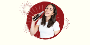 Girl smiling and drinking from vintage Dr Pepper bottle
